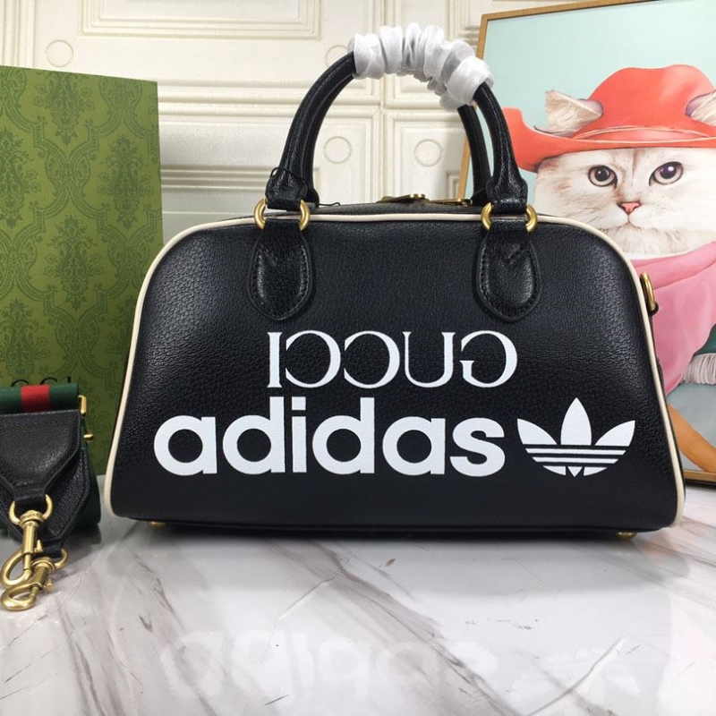 G*u*i top handle bags